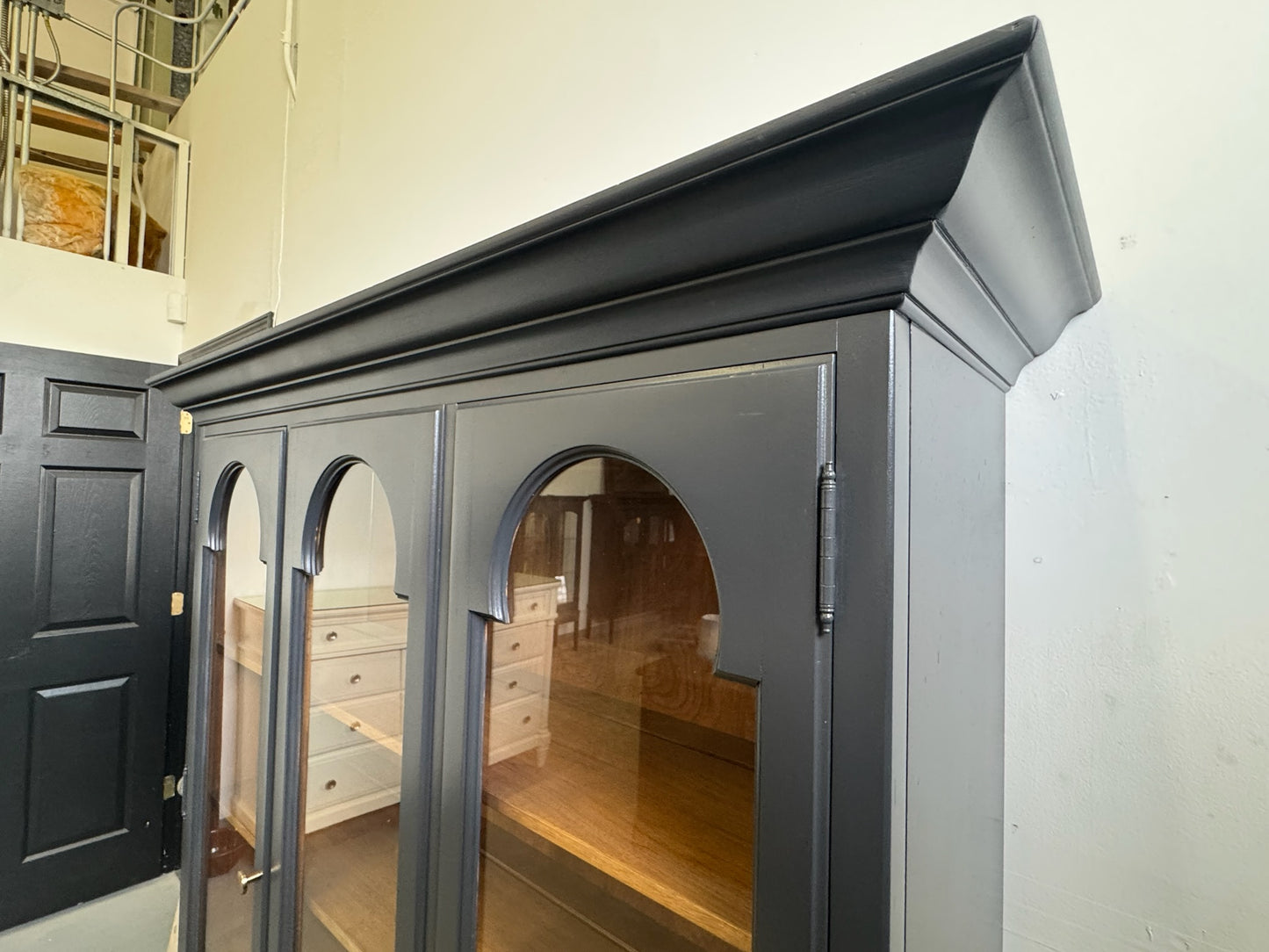 Black Hutch with Arched Doors and Wood Base
