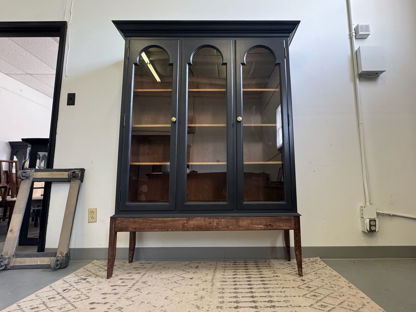 Black Hutch with Arched Doors and Wood Base